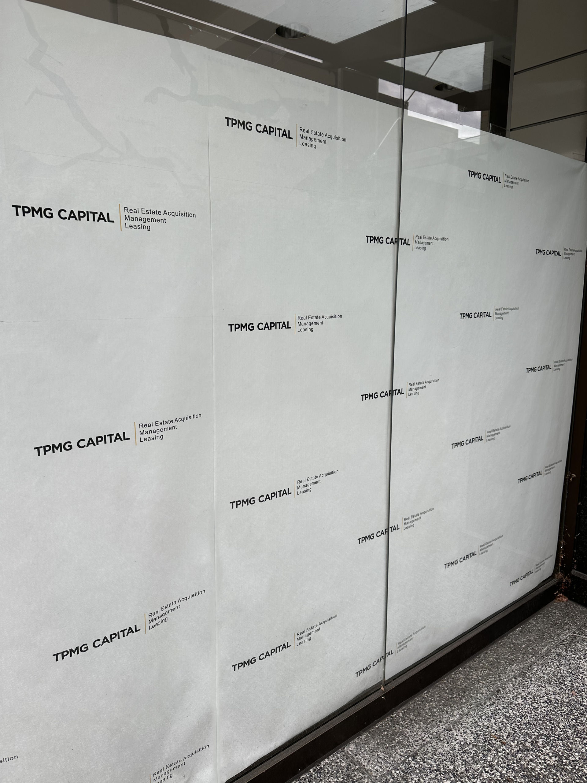 Custom Branded Window Paper for TPMG CAPITAL, Granville St., Vancouver, BC, Retail Space